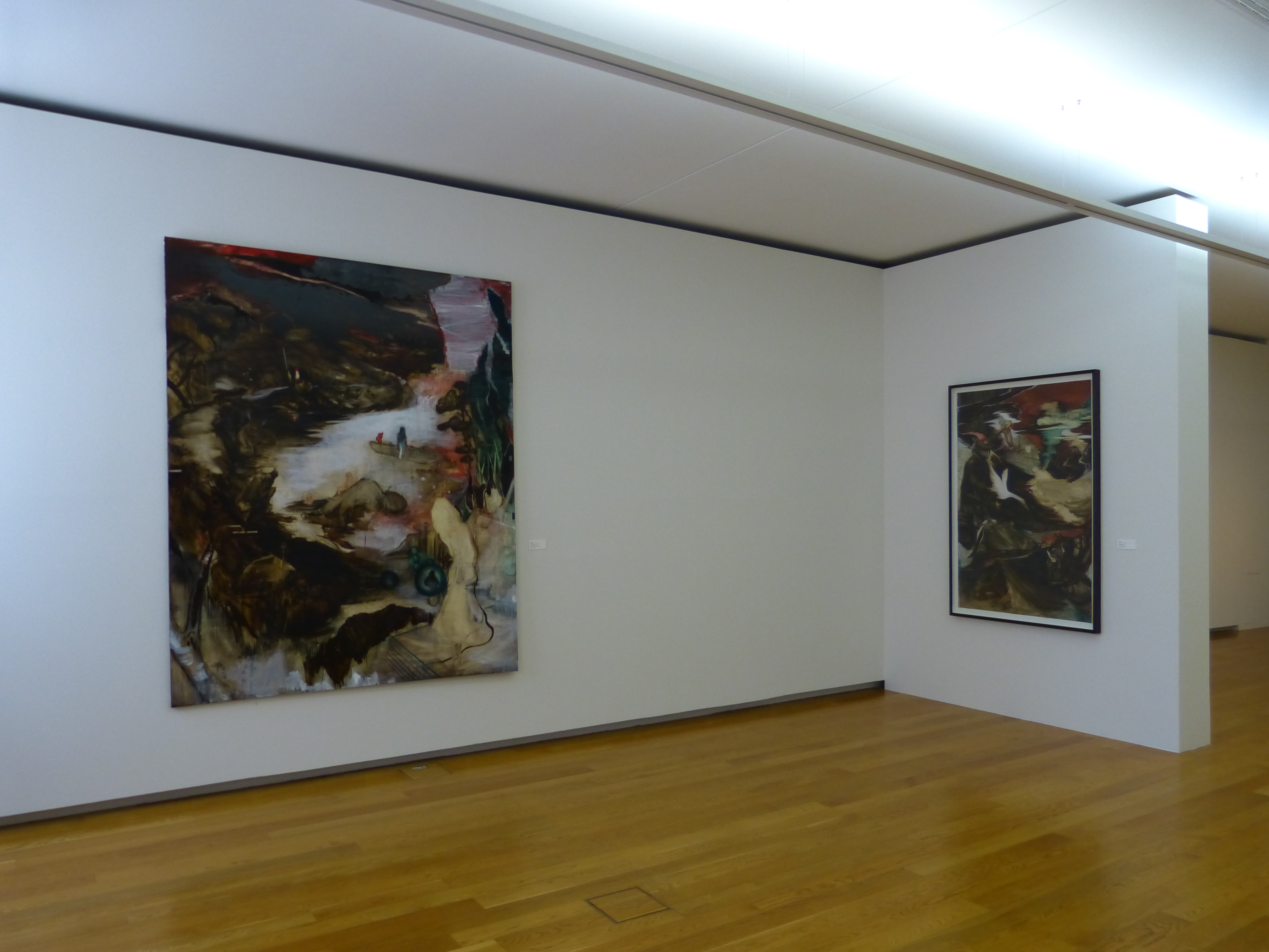 AI generated: The image shows a museum room with two modern paintings on white walls, presented on a wooden floor. The focus is on the abstract art on the walls.